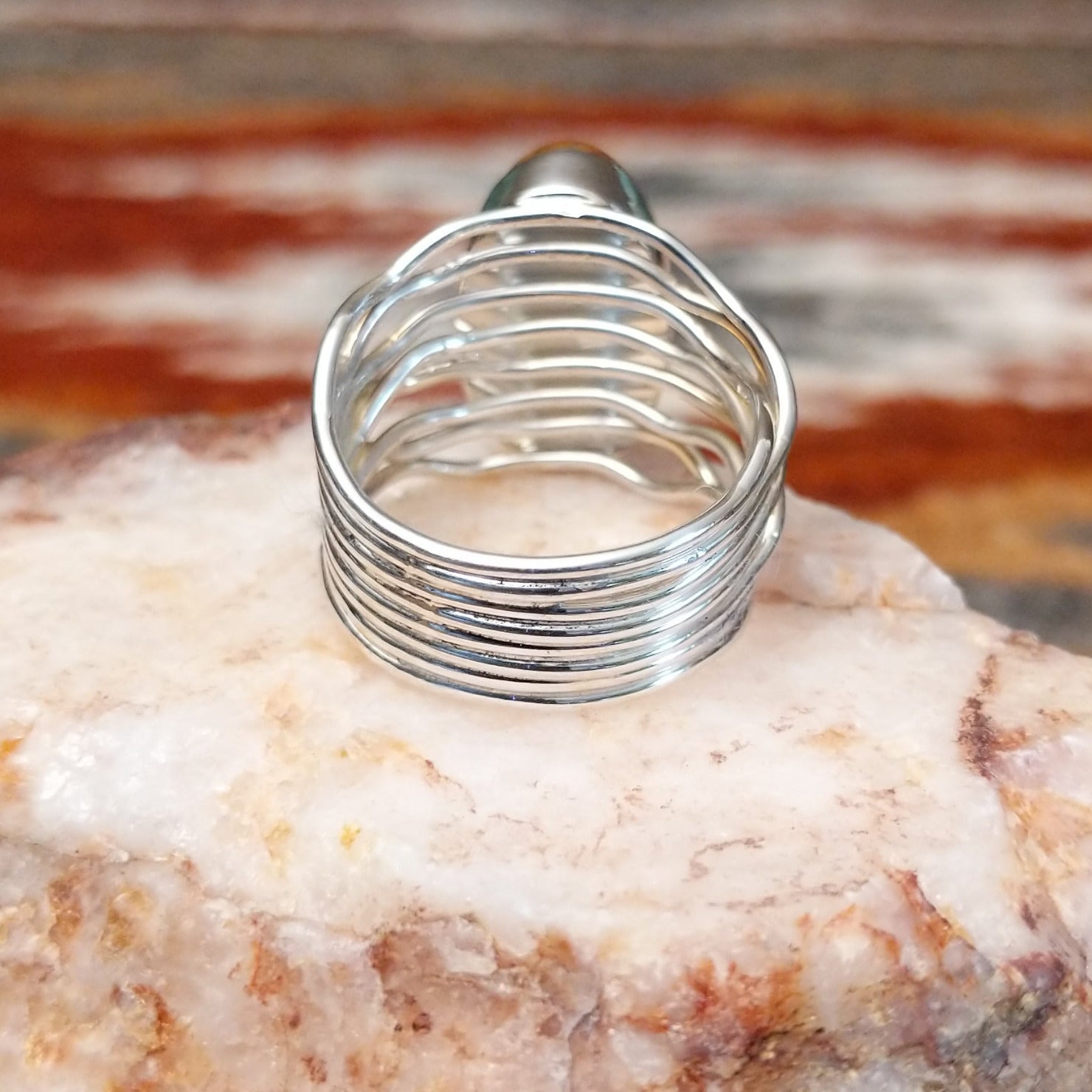 Close-up of the layered, wire band of the ring.