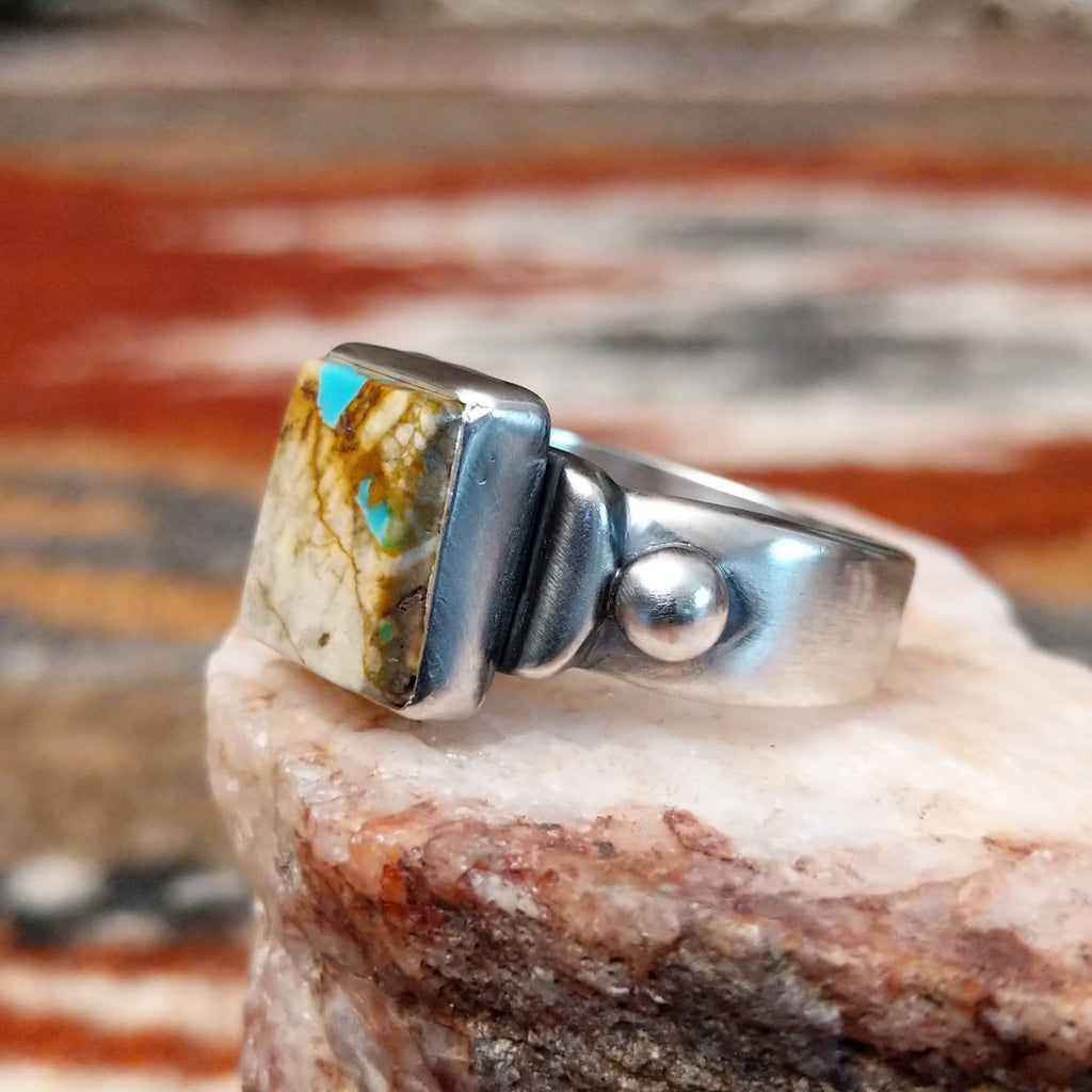 Square sterling silver bezel of the ring with boulder turquoise.