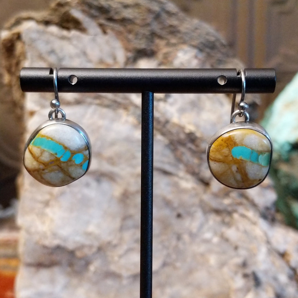 Round sterling silver earrings with boulder turquoise set in the bezels.