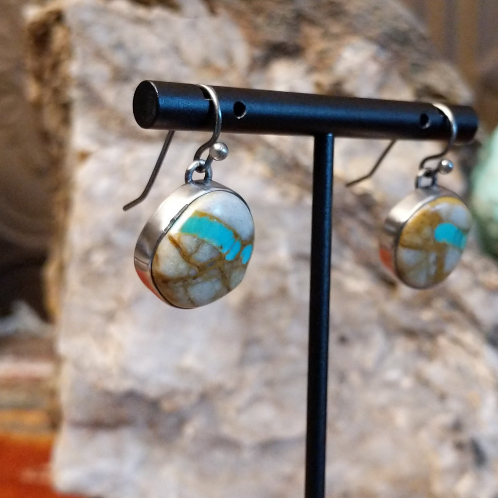 Round sterling silver earrings with boulder turquoise set in the bezels.
