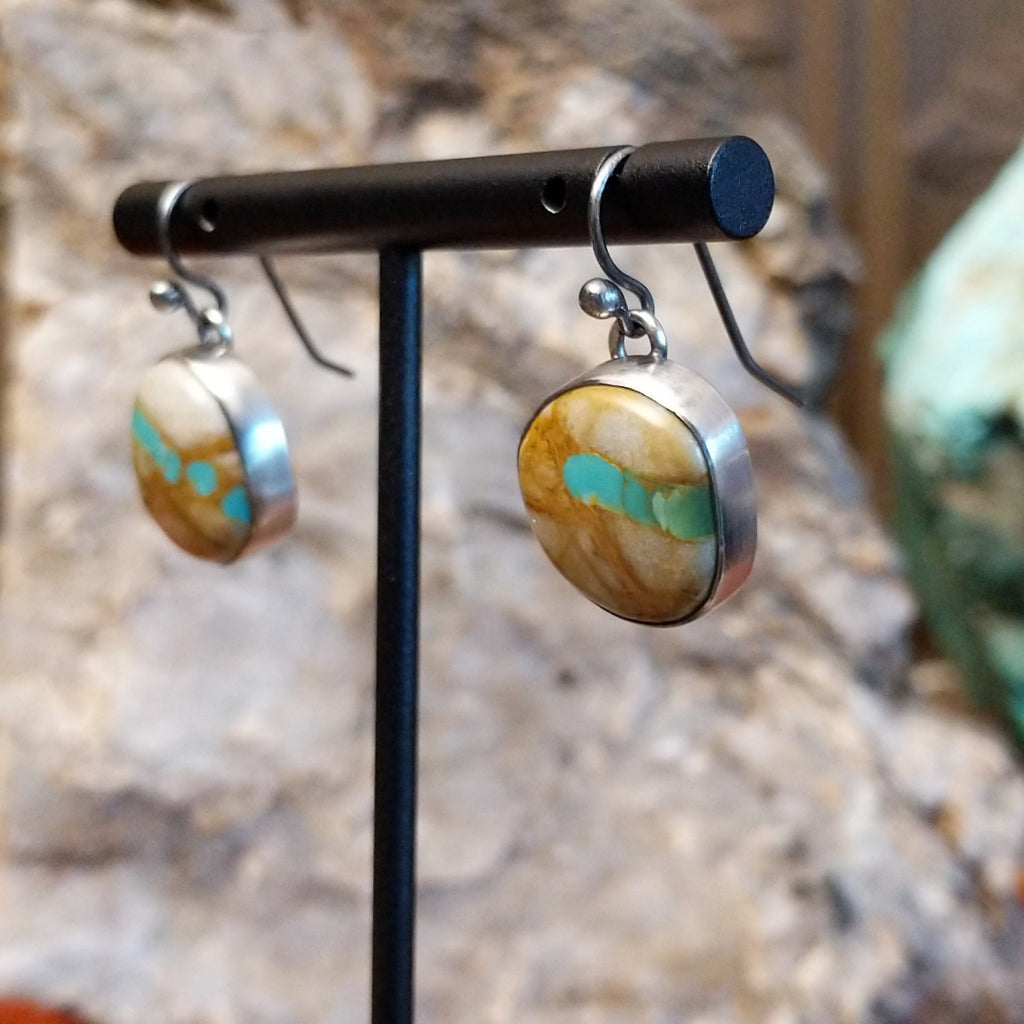 Round sterling silver earrings with boulder turquoise set in the bezels.