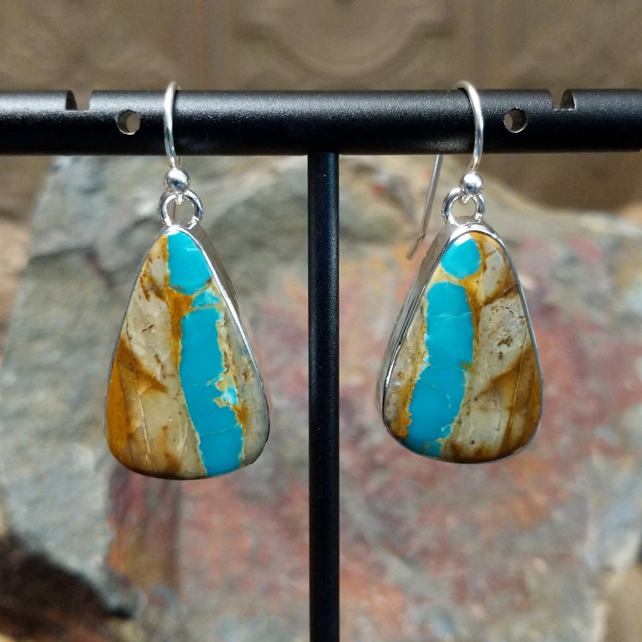 Handcrafted sterling silver Boulder Turquoise teardrop earrings by Lowell Draper, featuring natural Boulder Turquoise gemstones with vibrant blue and earthy matrix.