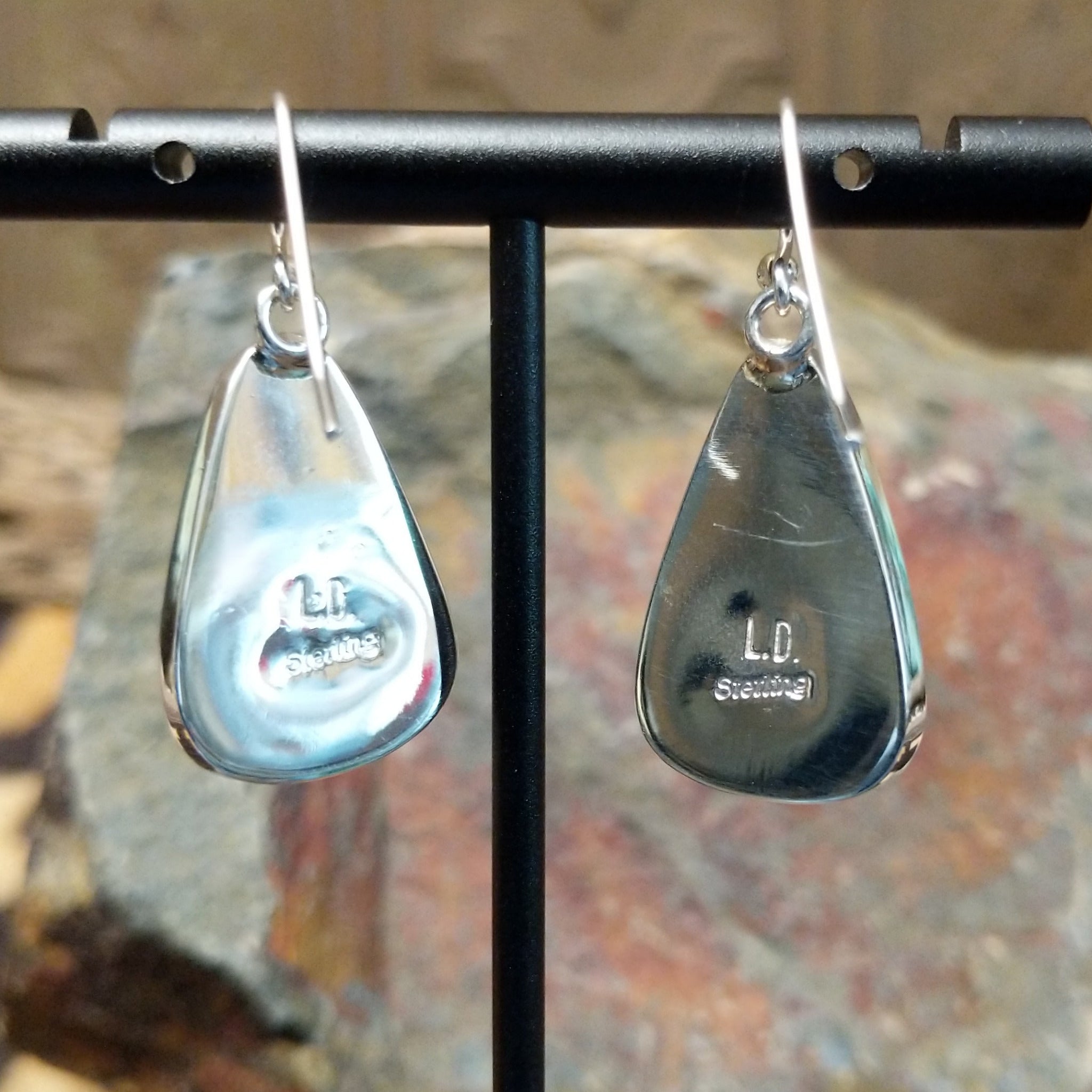 Handcrafted sterling silver Boulder Turquoise teardrop earrings by Lowell Draper, featuring natural Boulder Turquoise gemstones with vibrant blue and earthy matrix; artisan and Sterling Silver stamp.