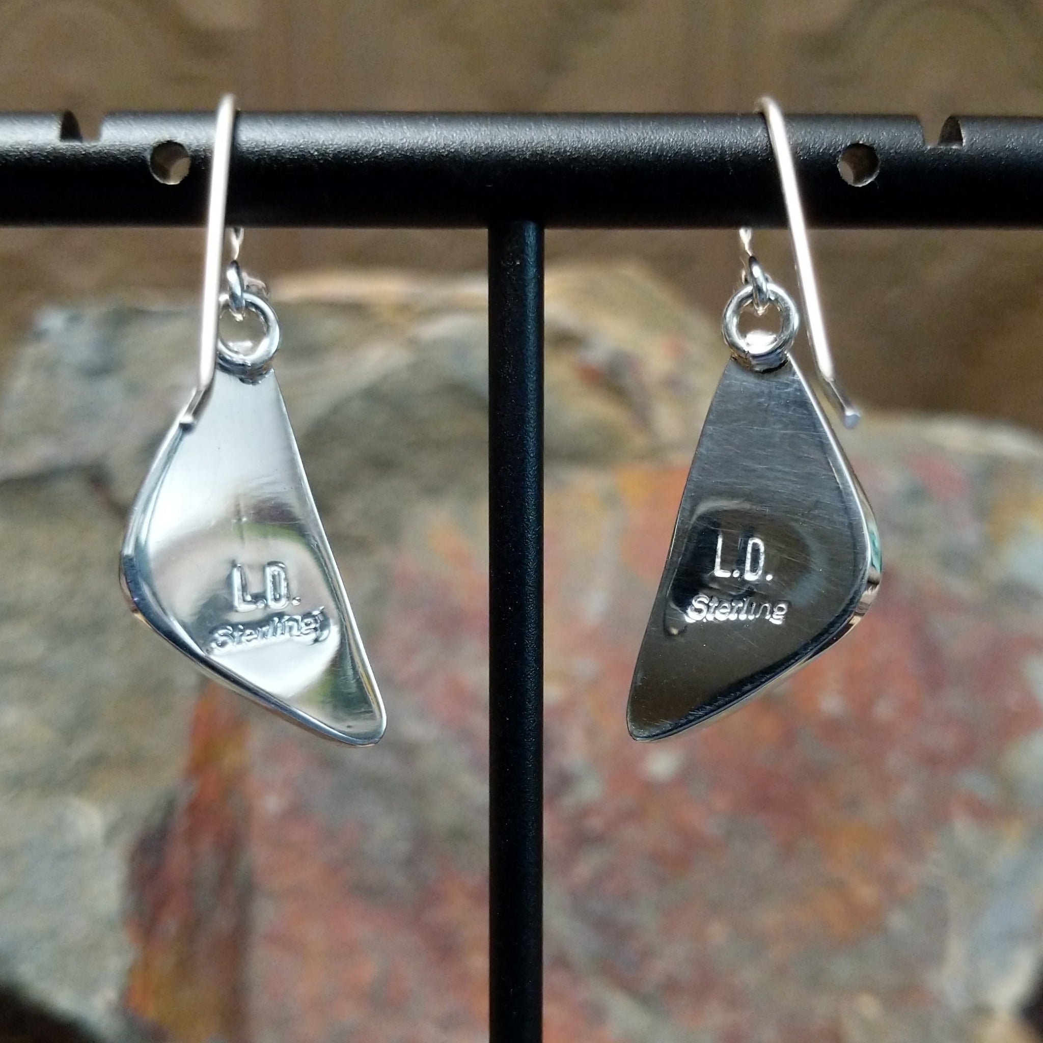 Handcrafted sterling silver Boulder Turquoise triangle earrings by Lowell Draper, featuring natural Boulder Turquoise gemstones in classic bezel settings; artisan and Sterling Silver stamp.