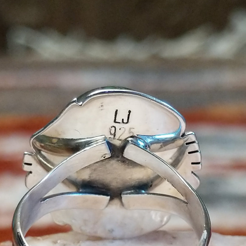 Close-up of the artisan's stamped signature.