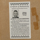 Close up of the Certificate of Authenticity and Artist information. 