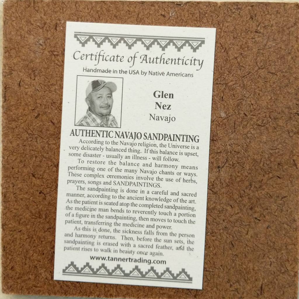 The artisan's authentication tag about the sand painting.