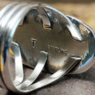 Bumblebee jasper capsule ring by Terry Wood, featuring a capsule-shaped bumblebee jasper stone with natural yellow, orange, black, and gray patterns set in a handcrafted sterling silver band.  Artisan and Sterling Silver stamp.