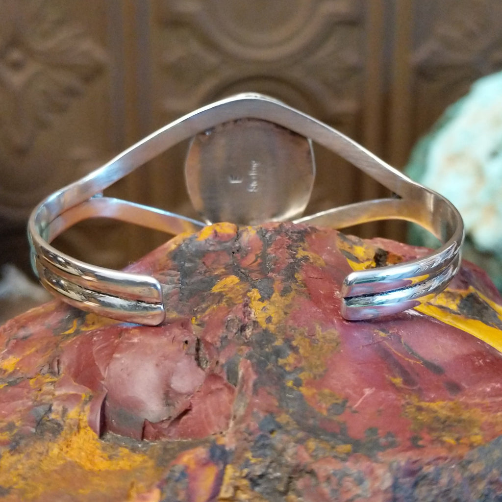 Bumblebee jasper set in a twisted rope bezel with sterling silver duel-layered band.