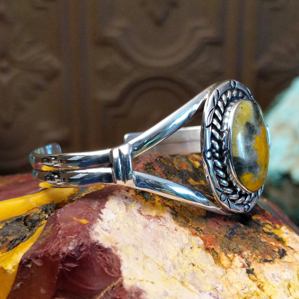 Bumblebee jasper set in a twisted rope bezel with sterling silver duel-layered band.