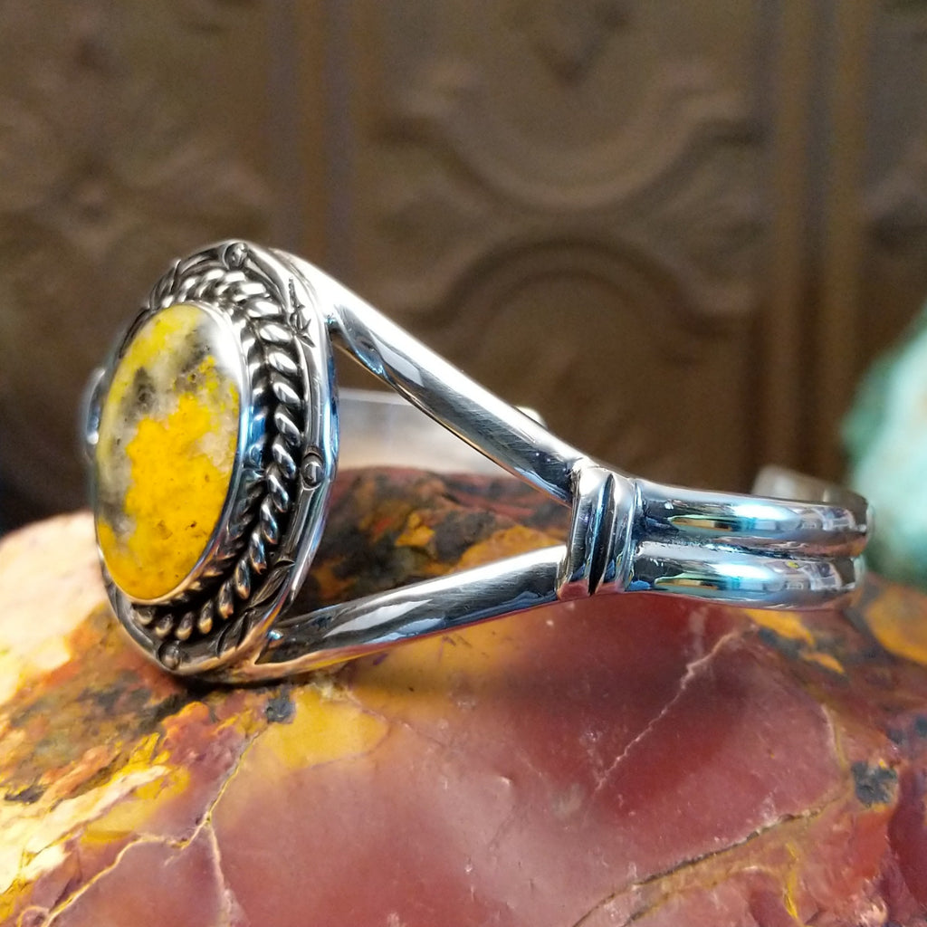 Bumblebee jasper set in a twisted rope bezel with sterling silver duel-layered band.