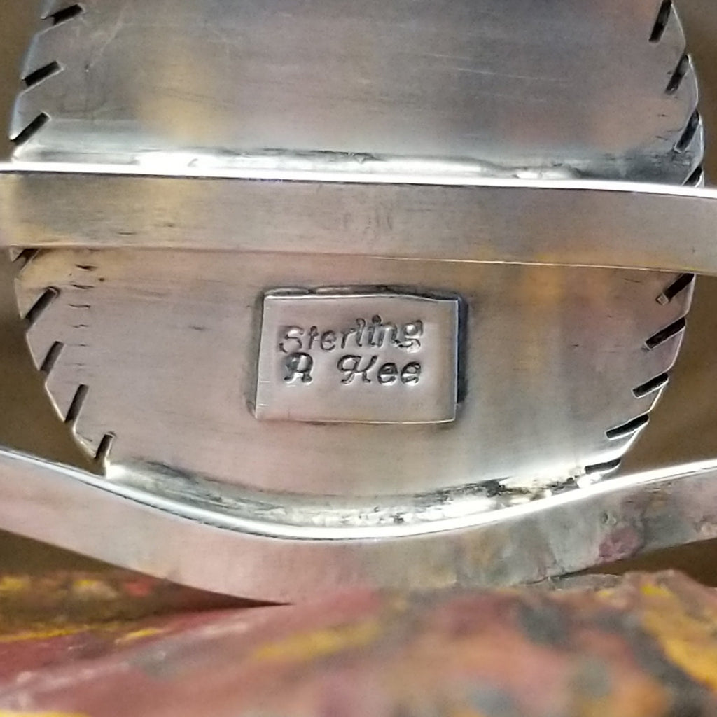 The back features the artisan's stamp.