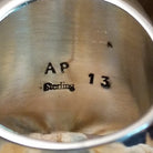 Close-up of the artisan's stamped signature.