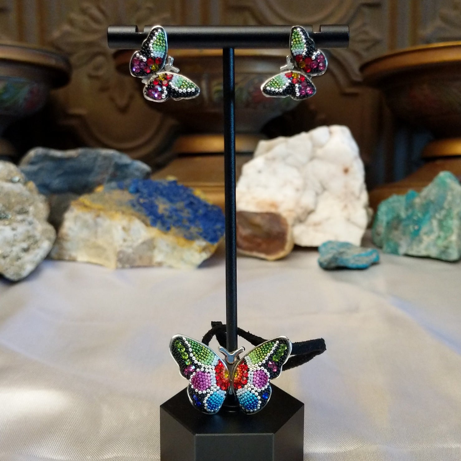 Sterling silver necklace and earrings with Austrian crystal set on the butterfly  settings.