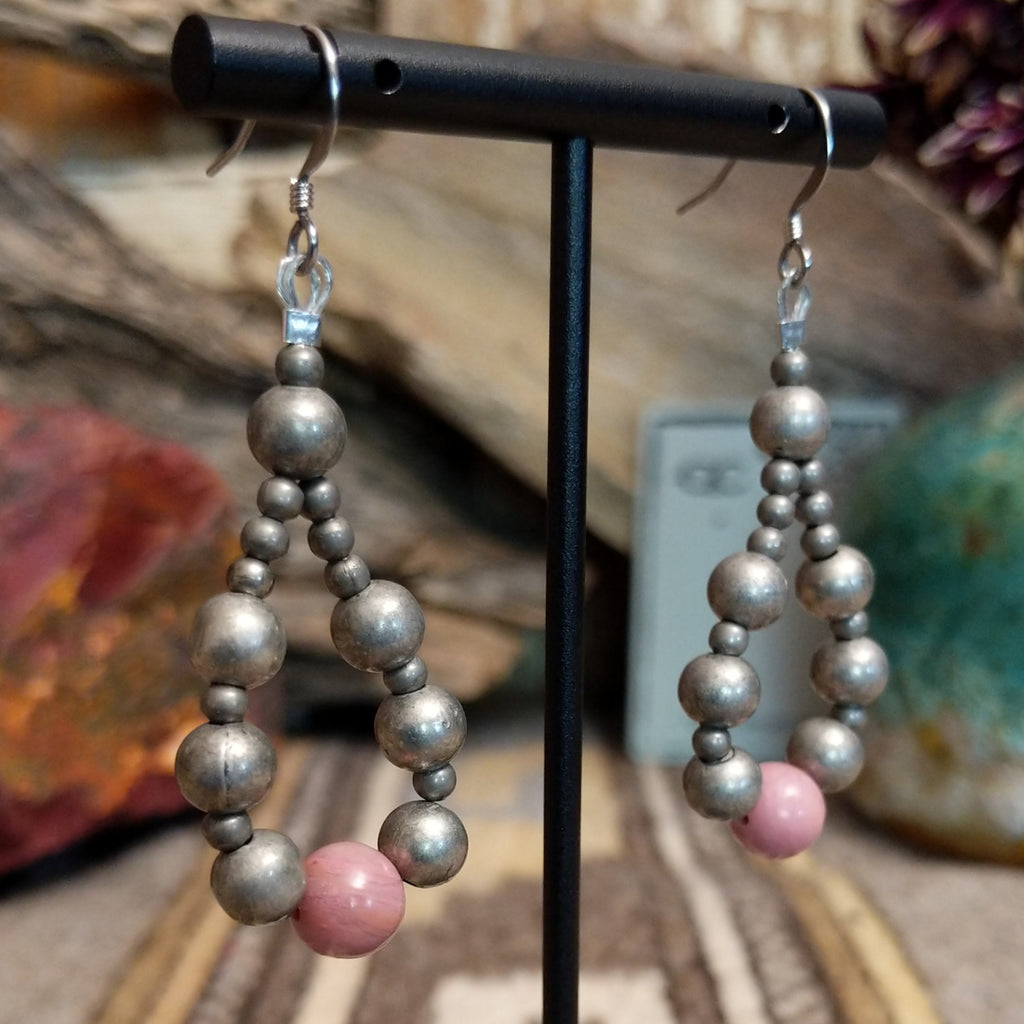 A pair of silver and pink beaded earrings with hypoallergenic posts.