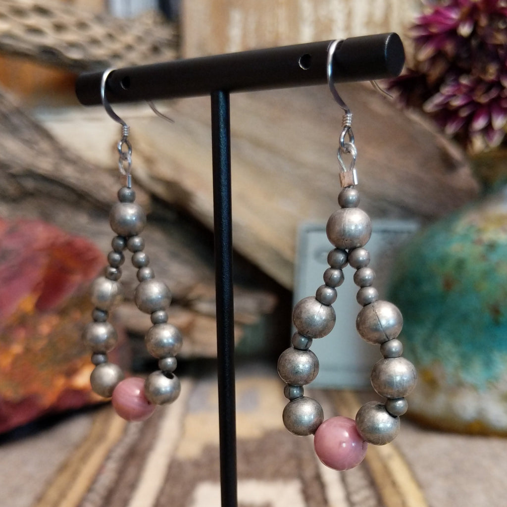A pair of silver and pink beaded earrings with hypoallergenic posts.