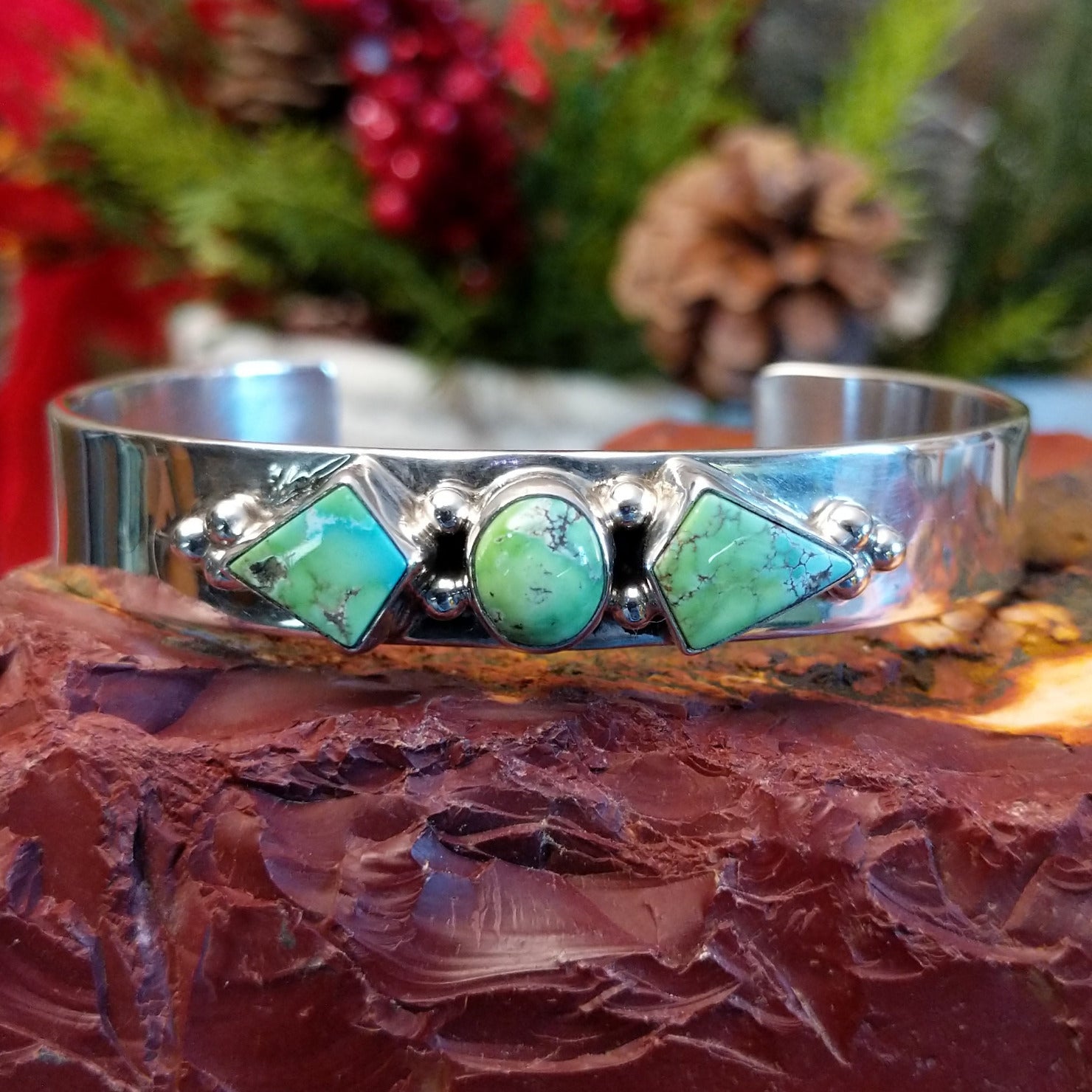 Sterling silver cuff bracelet with Carico Lake turquoise set in three bezels.