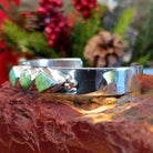 Sterling silver cuff bracelet with Carico Lake turquoise set in three bezels.
