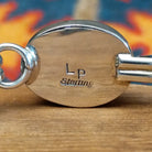 Close-up of the artisan's stamped signature.