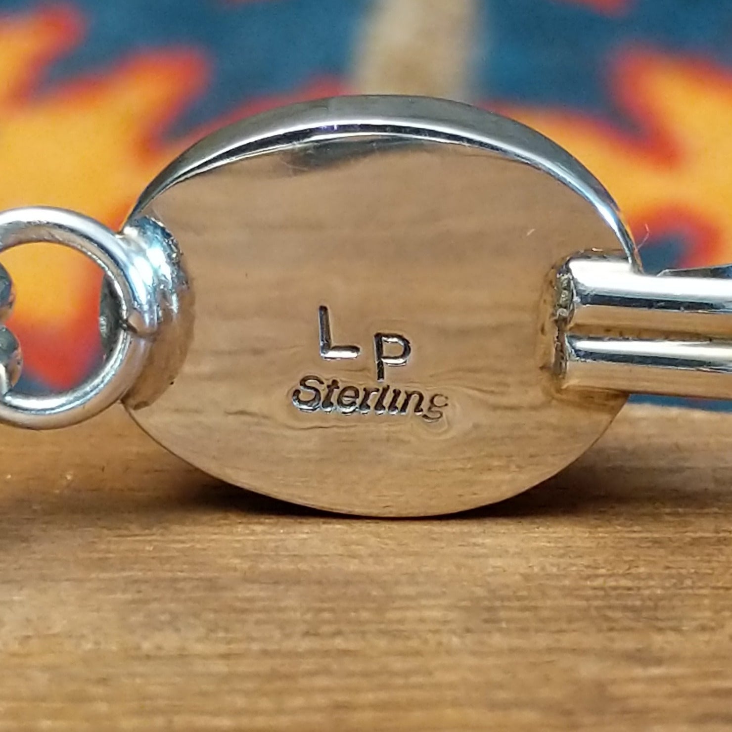 Close-up of the artisan's stamped signature.