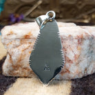 Close-up of the artisan's stamped signature.
