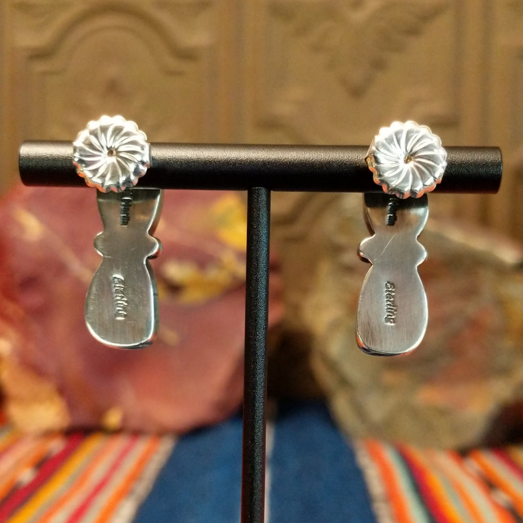 The backs of the earrings are stamped.