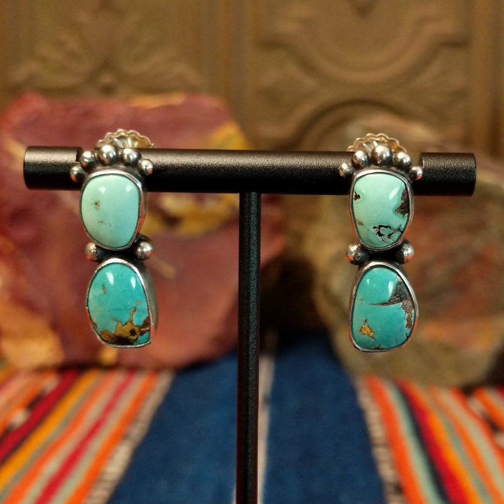 Two Chinese turquoise set in sterling silver bezels with dotted accents of the earrings.