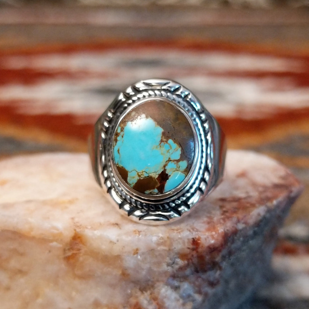 Circular boulder turquoise set within the bezel of the sterling silver ring.