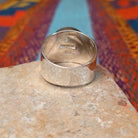 Circle Turquoise Inlay Ring by E.D. with crossed silver line details and wide polished band.