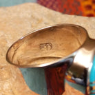 Close up of the artist's stamped signature