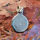 Close-up of the artisan's stamped signature.