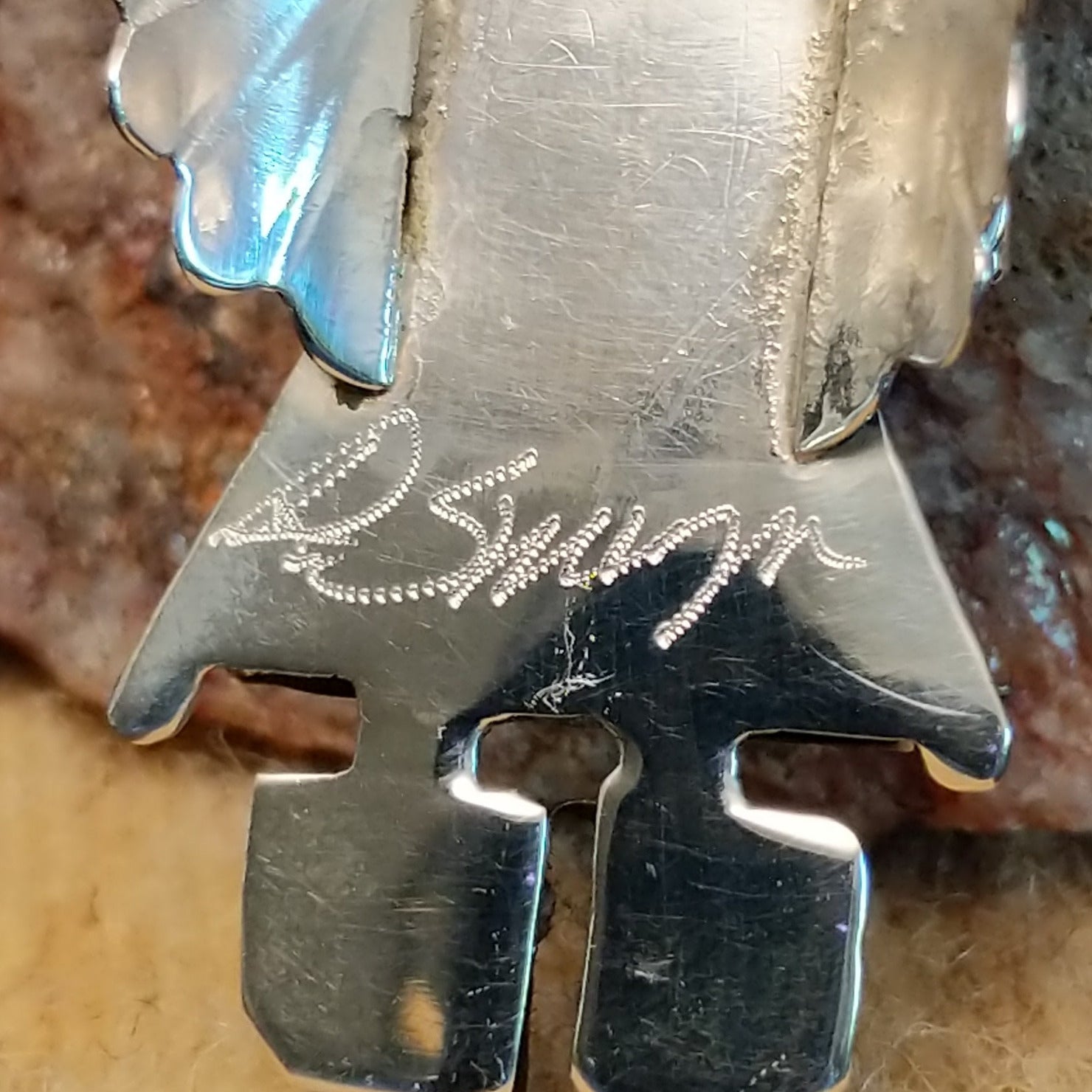 Close-up of the artisan's signature.