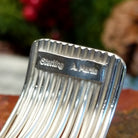 Close-up of the artisan's stamped signature.