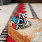 Coral and turquoise silver ring by Pauline Nelson with curved stamped silverwork.