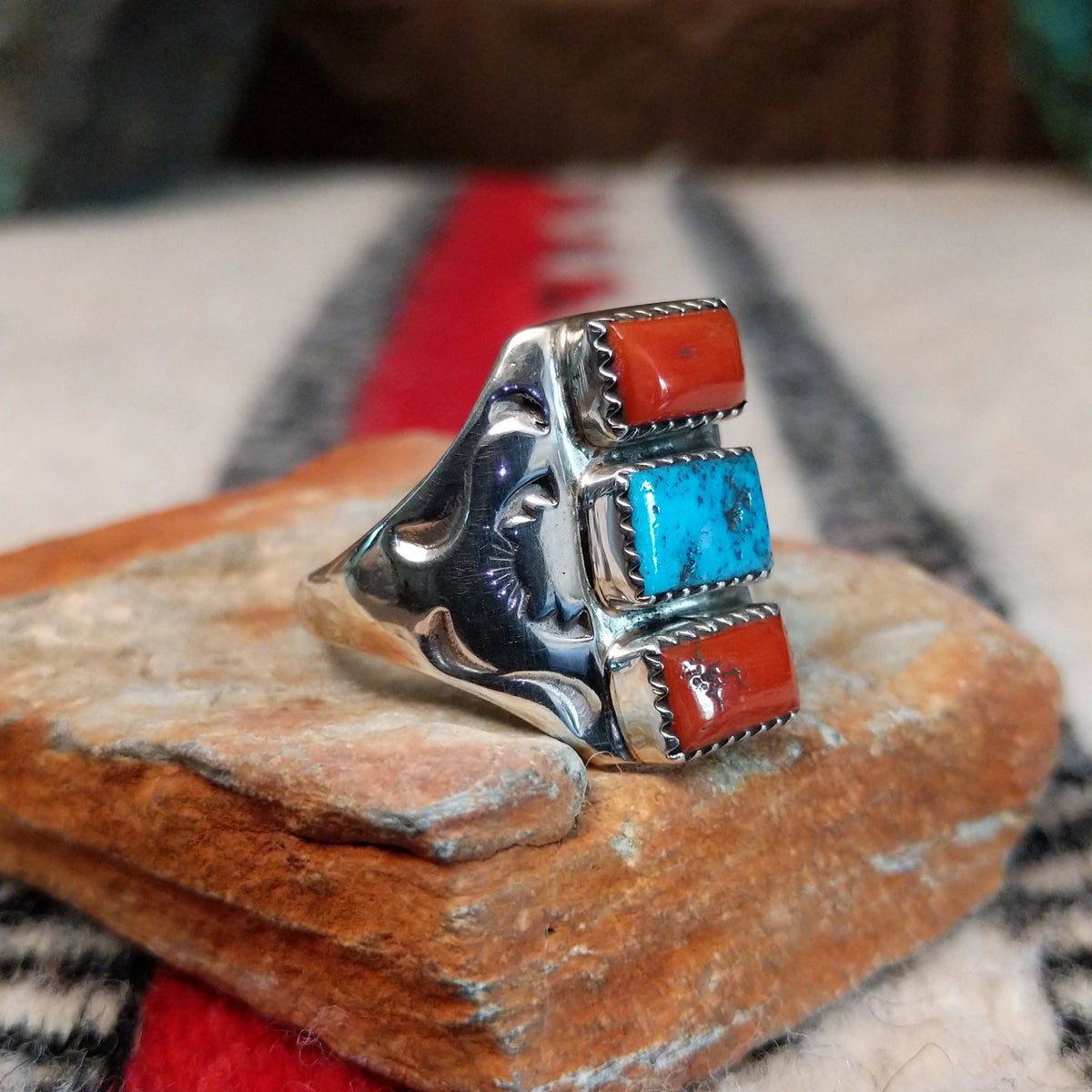 Coral and turquoise silver ring by Pauline Nelson with curved stamped silverwork.