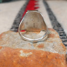 Coral and turquoise silver ring by Pauline Nelson with curved stamped silverwork.