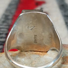 Close up of the artist's stamped signature