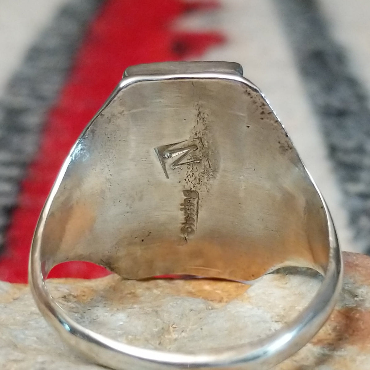 Close up of the artist's stamped signature