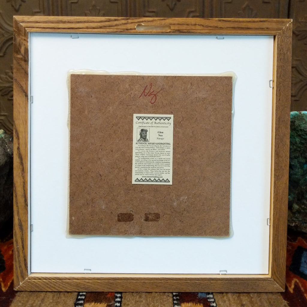 The back features a place to hook the painting and authentication tag.
