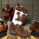 This adorable 18-inch Cow Print Boot Stocking features a Western cowboy boot design with plush brown and white cow print, a soft brown suede-like finish, and a hanging loop for Christmas decorating.