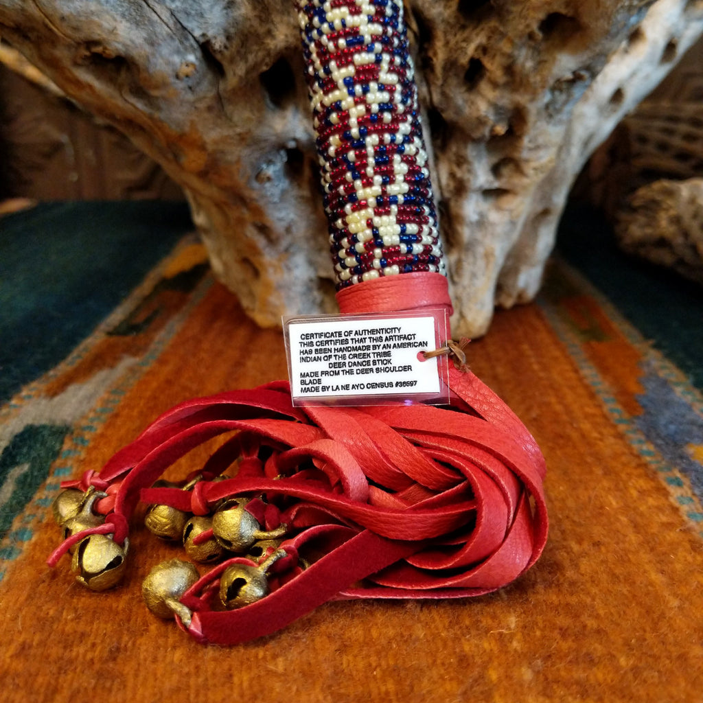 Authentication tag is found at the base of the red, leather fringe.