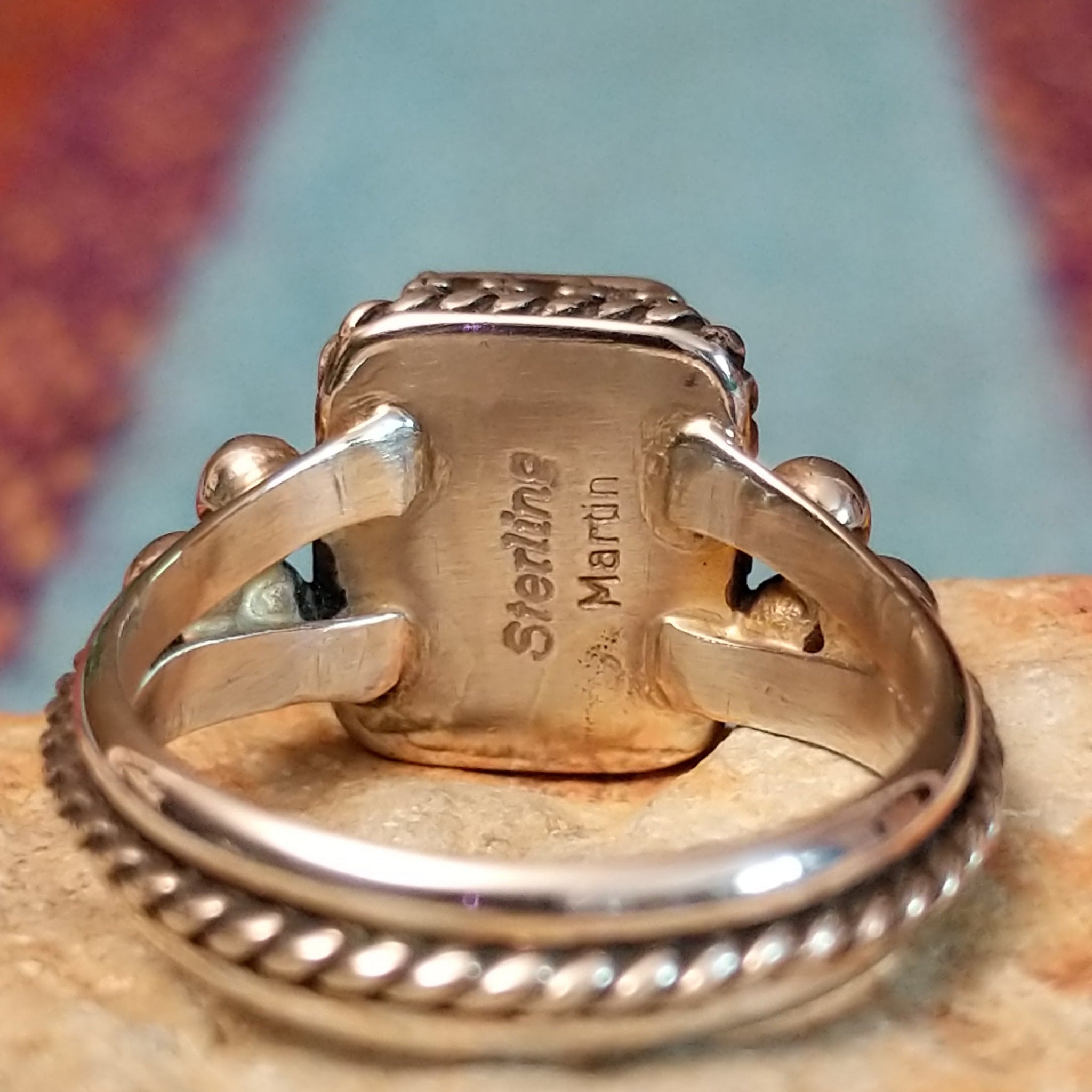 Close up of the artist's stamped signature