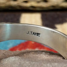 Deep stamped sterling silver cuff by Jerrold Tahe, featuring bold hand-stamped patterns with deep texture on a handcrafted open sterling silver cuff.  Artisan stamp.