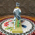 "Desert Buckaroo" collectible pony by The Trail of Painted Ponies, featuring detailed hand-painted desert-inspired artwork, Western themes, and vibrant colors.  Rear view.