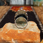 Back of the ring features an adjustable band for larger sizes.