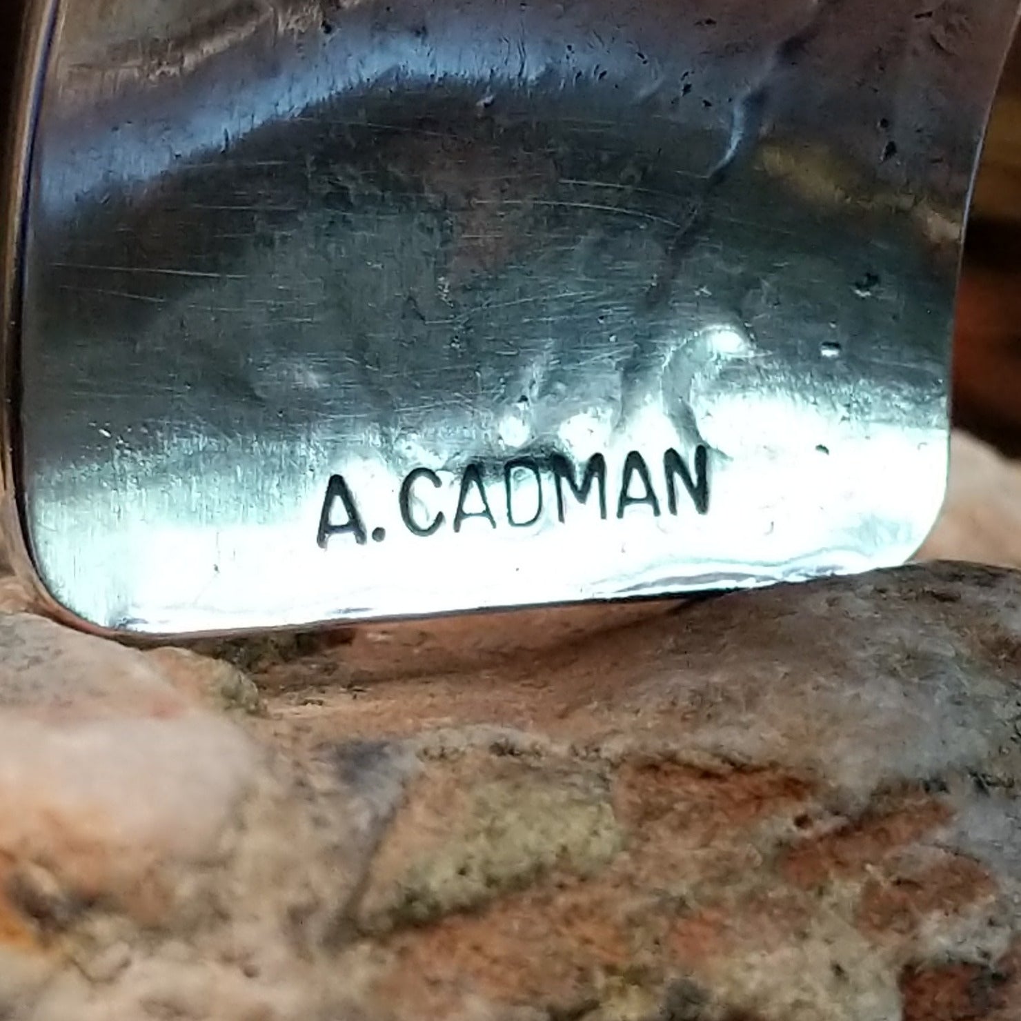 Close up of the artist's stamped signature.