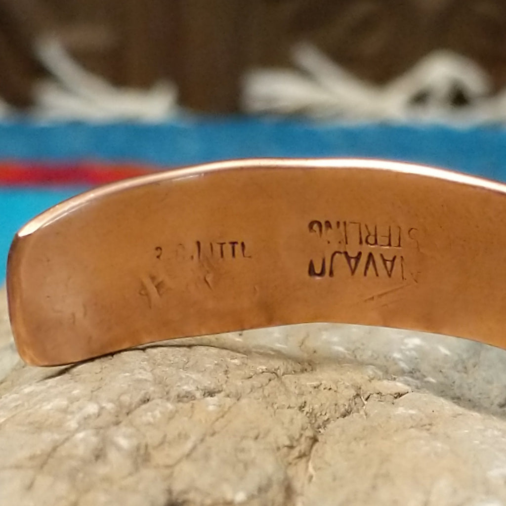 Close-up of the artisan's signature.