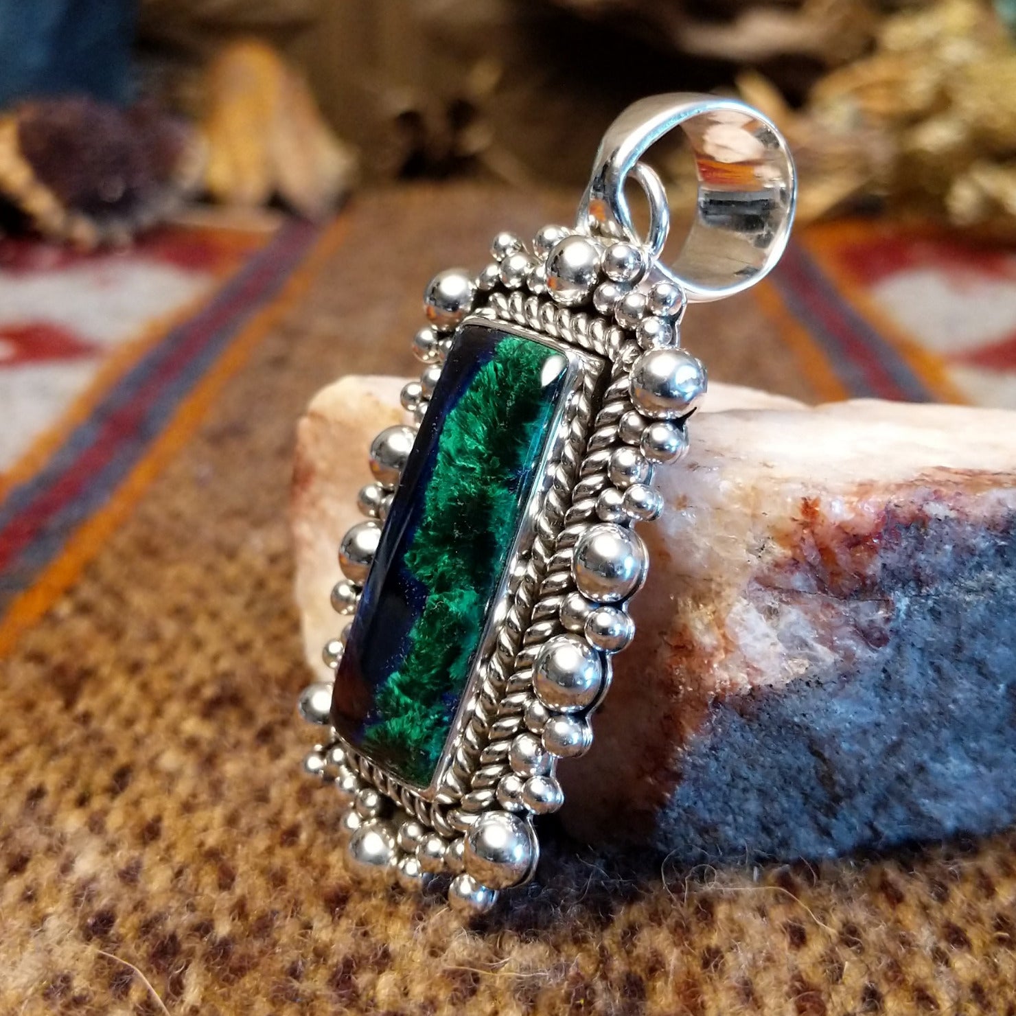 Square sterling silver pendant with azurite set within the bezel, twisted rope accents, and dotted detailing.