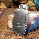 Close-up of the artisan's stamped signature.