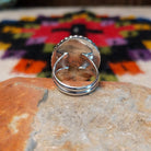 This Black Onyx Ring by J. Frank features a large oval black onyx stone set in sterling silver with twisted rope detailing and a raised beaded border; underside view.